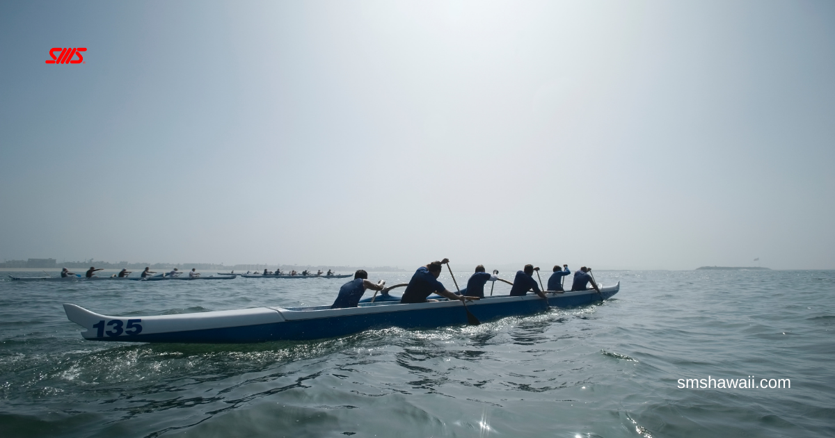 Teamwork: Outrigger canoe paddling in unison